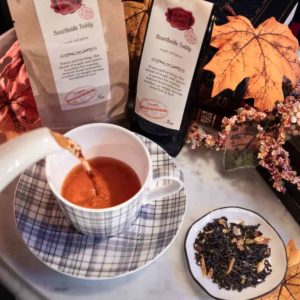 Online Tea Shop Loose Leaf Black Tea - Hearthside Toddy Pouring in Teacup Maple Spice
