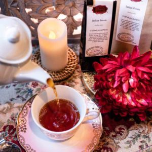 Online Tea Shop Loose Leaf Black Tea - Indian Assam Pouring in Teacup Malty Breakfast