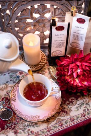 Online Tea Shop Loose Leaf Black Tea - Indian Assam Pouring in Teacup Malty Breakfast