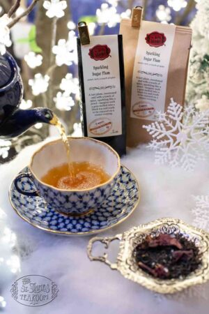 Online Tea Shop Loose Leaf Black Tea - Sparkling Sugar Plum Pouring in Teacup Tart Plum Winter