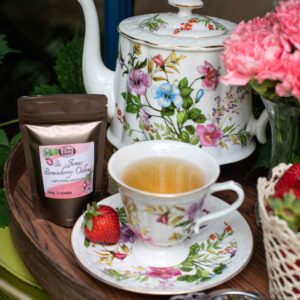 Online Tea Shop Loose Leave Oolongand Pouchong Tea - St. James Strawberry Oolong in a cup with strawberries 1oz bag