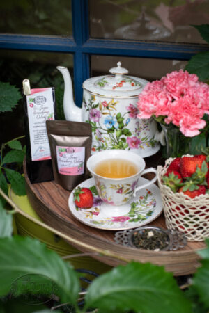Online Tea Shop Loose Leave Oolong and Pouchong Tea - St. James Strawberry Oolong in a cup with strawberries