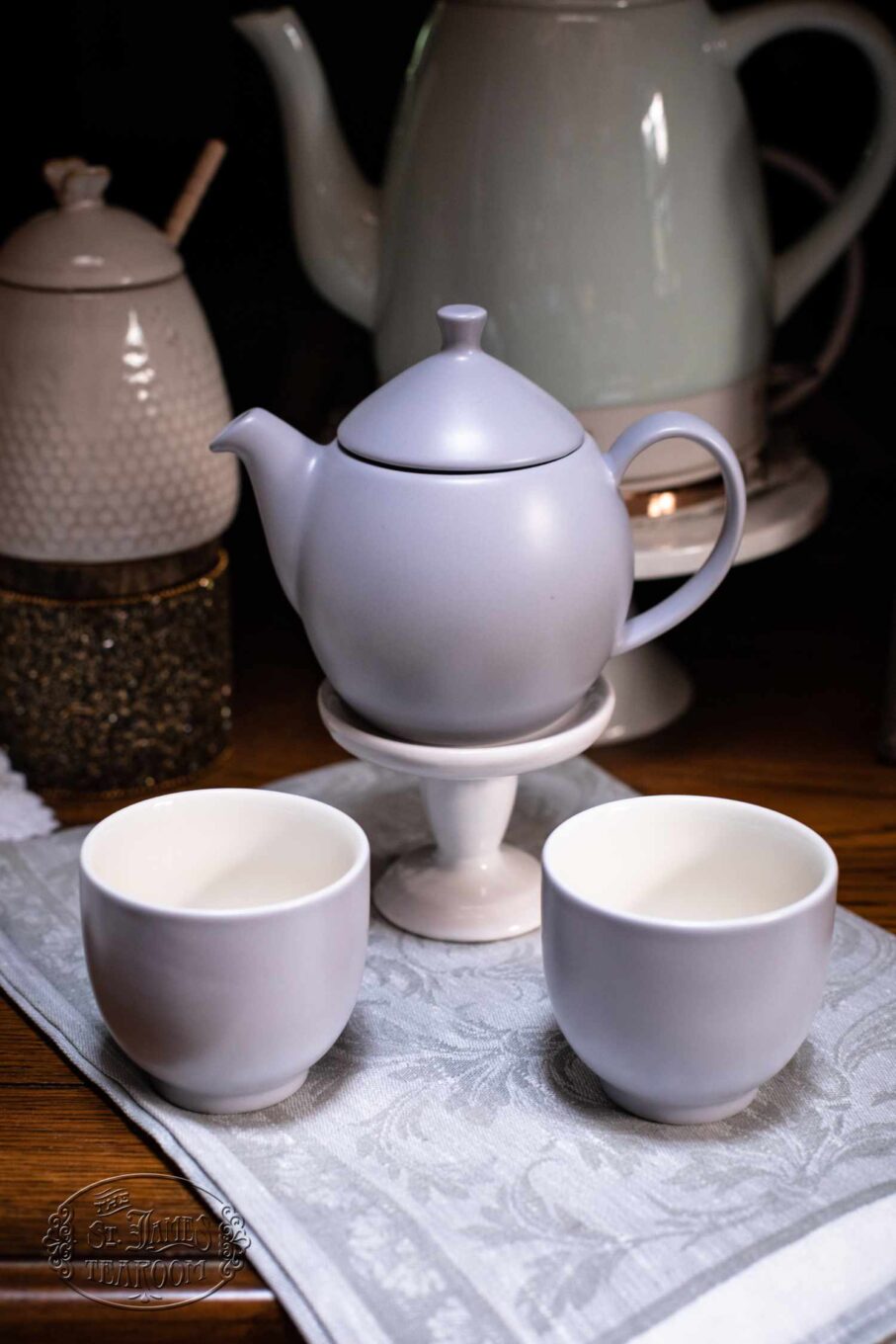 https://shop.stjamestearoom.com/wp-content/uploads/2023/07/Online-tea-Shop-Gifts-for-Tea-Lovers-Dew-Teapot-with-Basket-Infuser-14-oz.-Lavender-Mist-with-cups.jpg